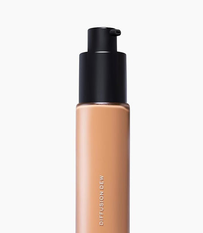MAKE Beauty Diffusion Dew Skin Tint. Sheer to Medium Coverage Radiant Finish. Blurring, Smoothing, and Brightening for Glowing Complexion. Enhanced with Niacinamide and Adenosine. Caramel 08